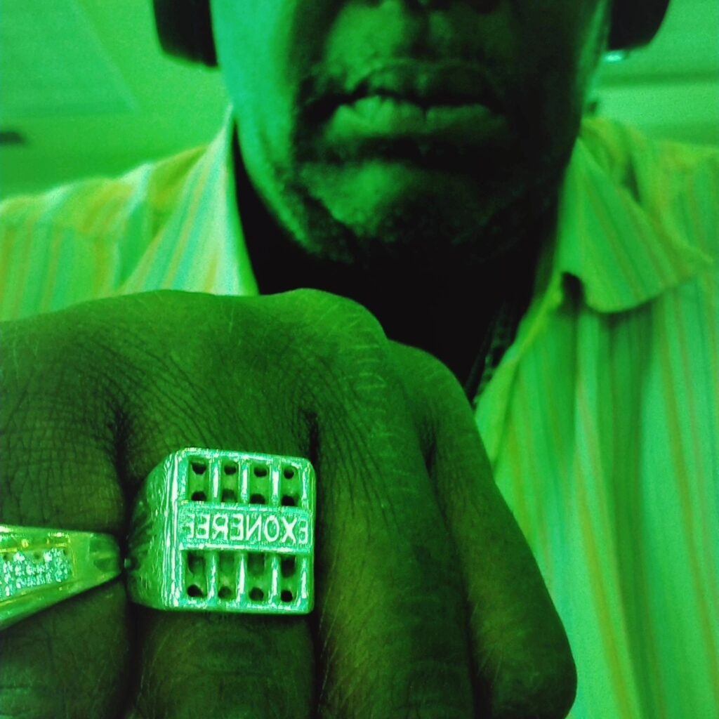Leslie Vass as an adult proudly wearing his exoneree ring, symbolizing his wrongful conviction and hard-fought exoneration.